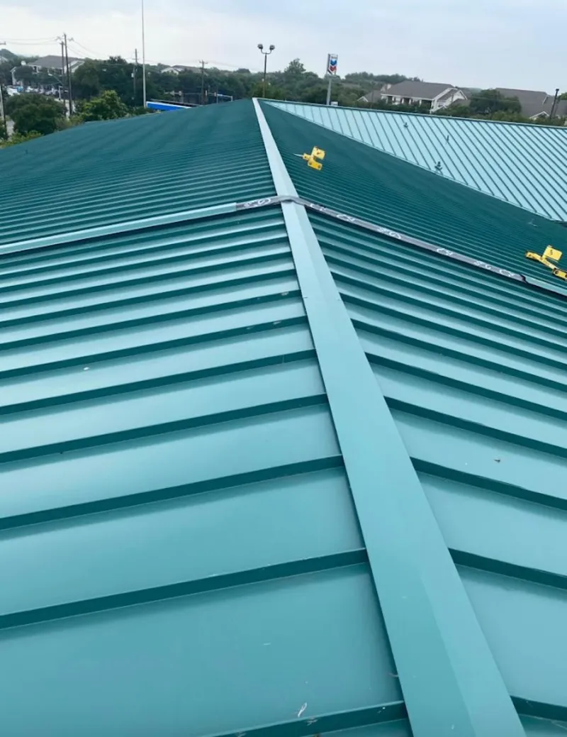 Green commercial metal roof ridge and valley for Metal Roof Repair in Granby